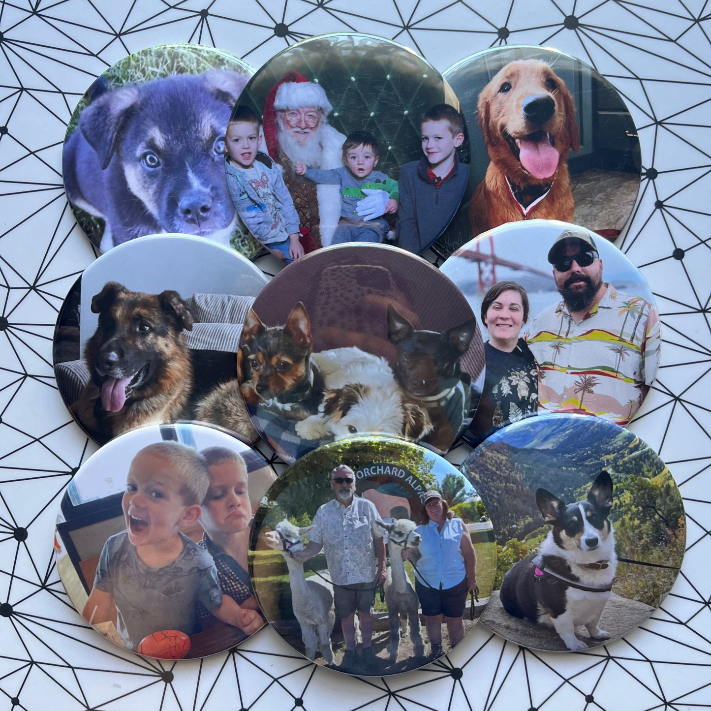 Collection of circular photo buttons with various images on a geometric patterned surface.