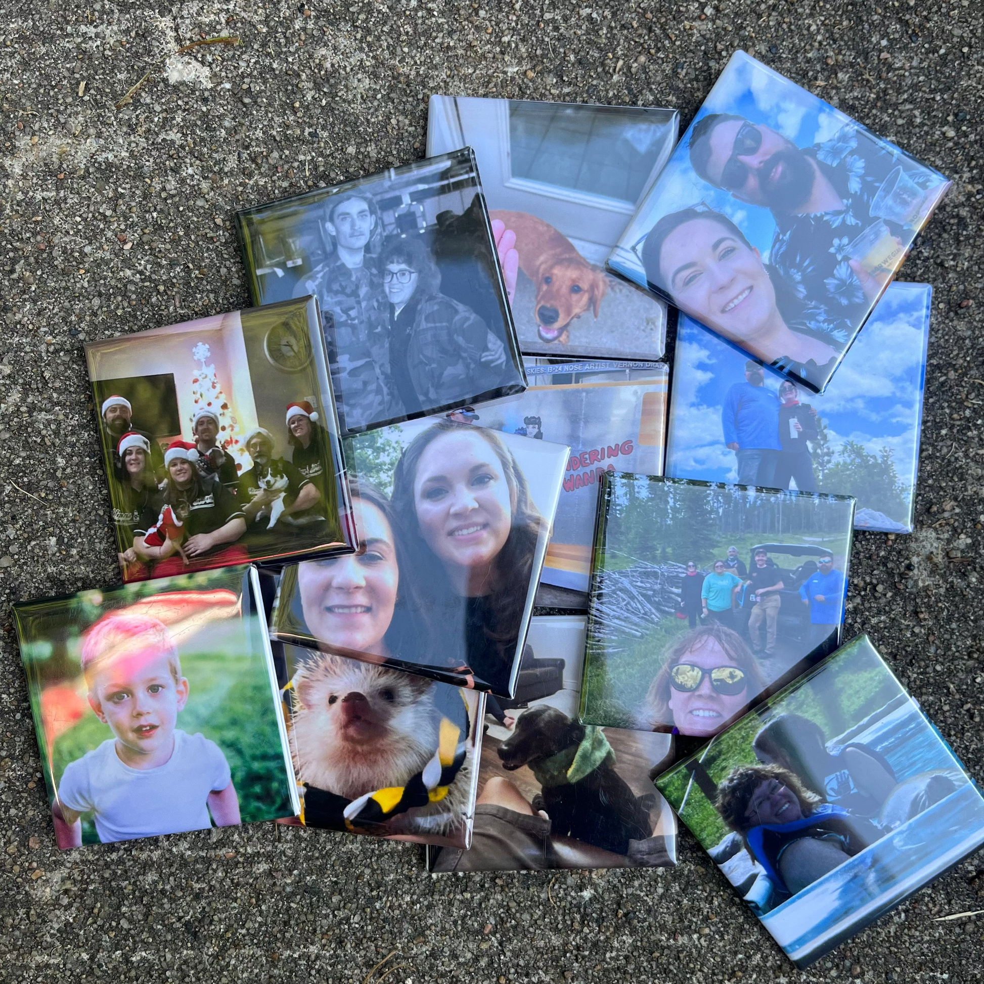 Collection of small photo magnets on a textured surface