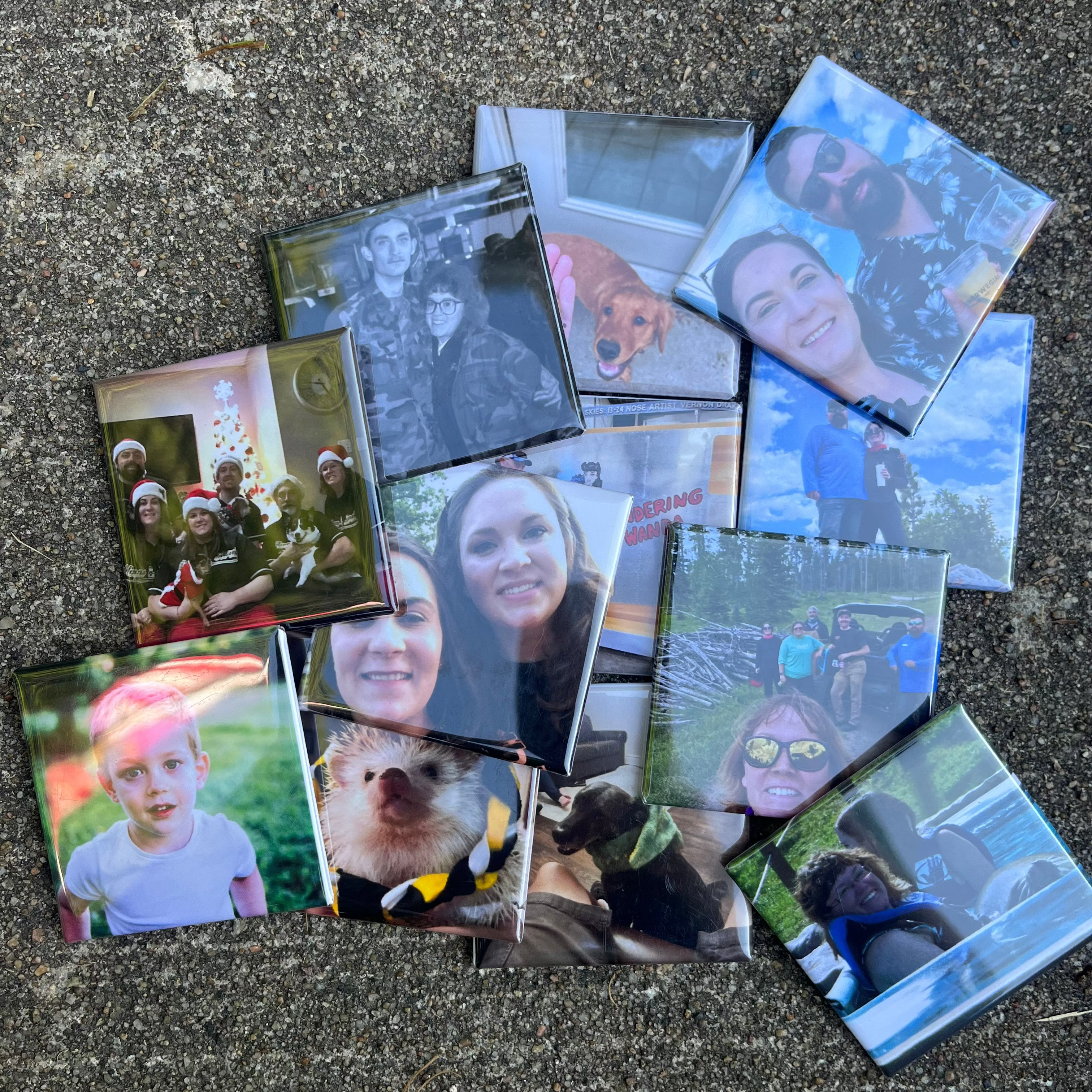 Collection of small photo magnets on a textured surface