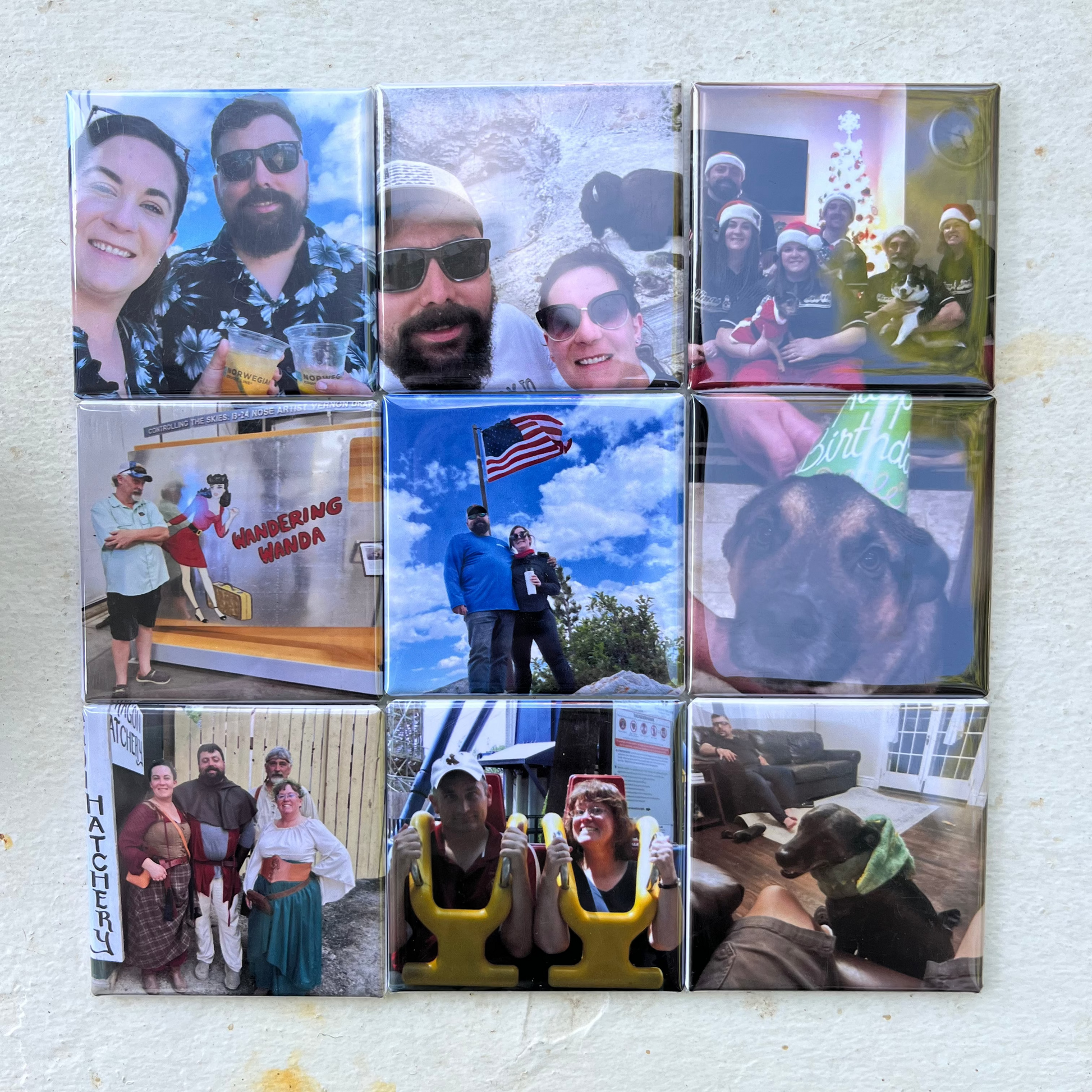 Small square tiles with various images of people arranged in a grid on a white frame.