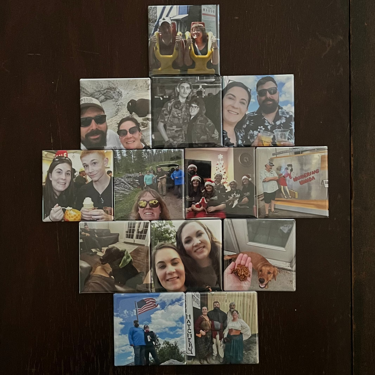 Collection of small photos arranged on a dark surface
