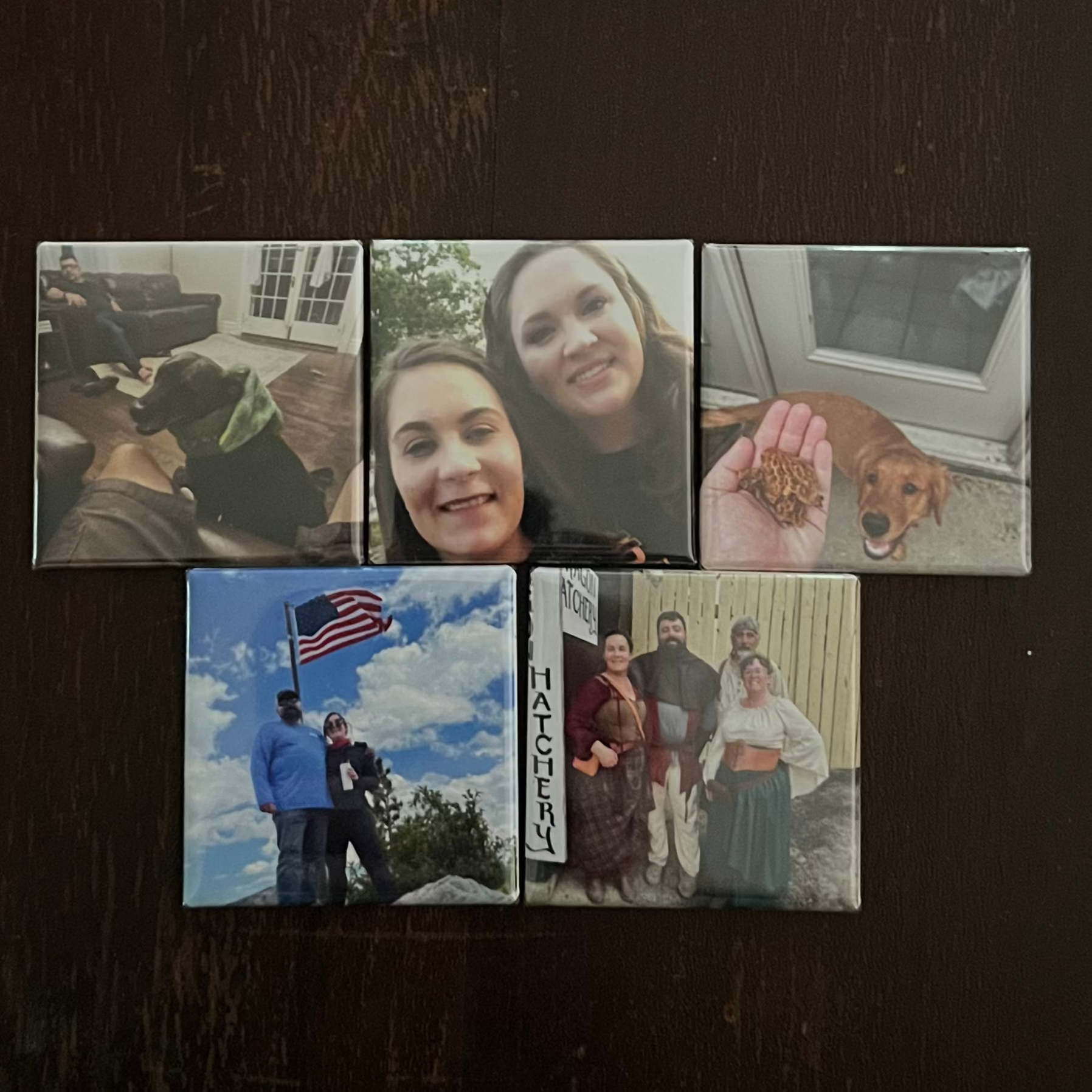 Collage of small photographs on a dark surface