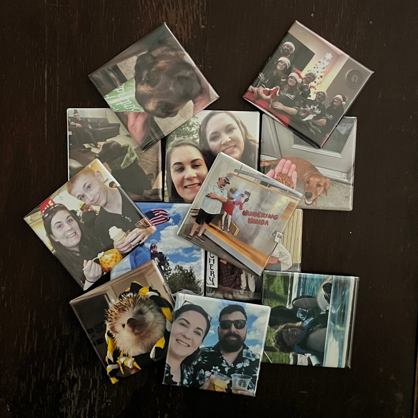 Collection of small photos on a dark surface