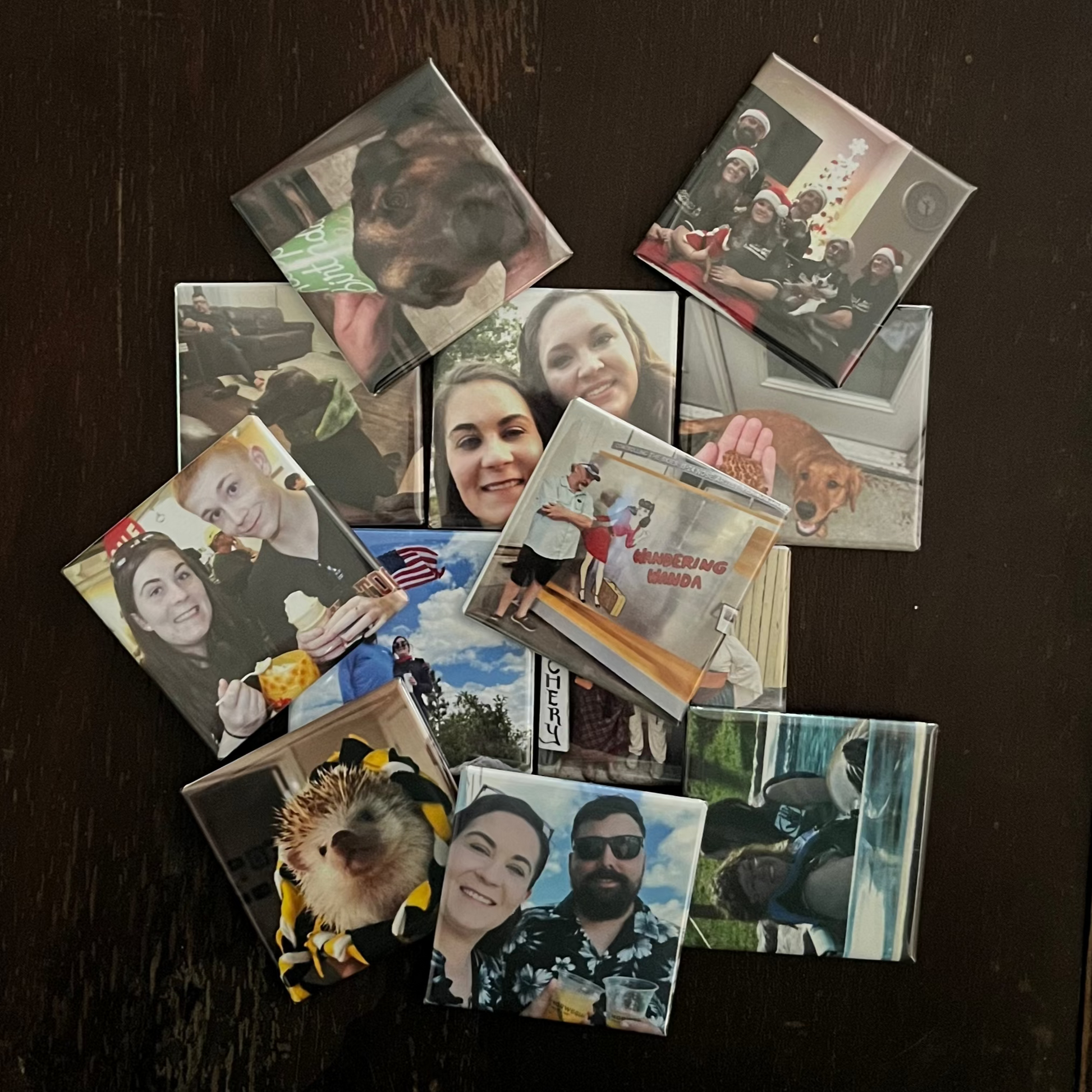 Collection of small photos on a dark surface